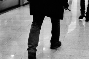 Emir Kusturica walking in the shopping centre.
