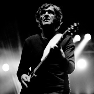 Emir Kusturica plaing guitar on the stage at the concert of No Smoking Orchestra.