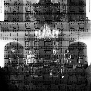 Double exposure of Kronos quartet members standing in front of the audience after their concert and the scores of their second violin player.